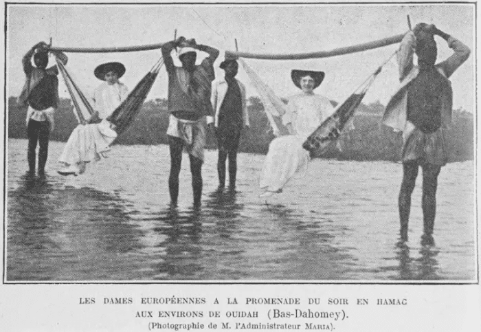 La división racial se muestra cuando las mujeres europeas son transportadas a través de un río por cargadores africanos.Biblioteca pública de Nueva York en Picryl