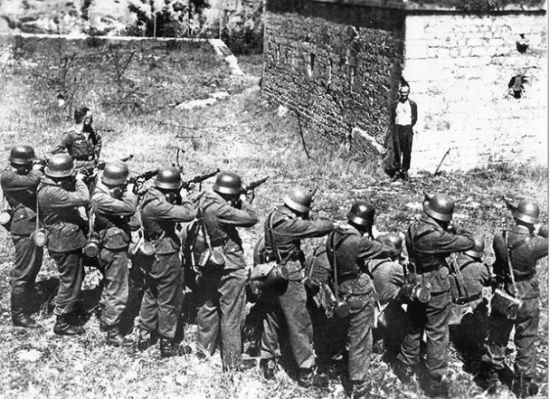 Georges Blind, a Member of the French Resistance, Smiling at a German Firing Squad. October 1944.