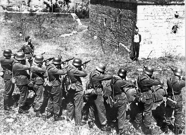 Georges Blind, a Member of the French Resistance, Smiling at a German Firing Squad. October 1944.